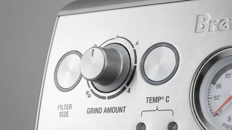 Close-up of Breville control panel showing the Grind Amount dial and temperature indicator lights