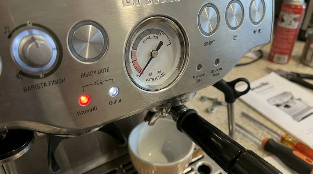 Close-up of the Breville espresso machine pressure gauge showing low pressure
